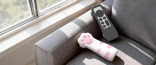 Black and white cat paw cases for the Apple TV Siri Remote in a living room