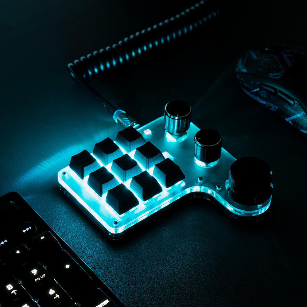 RGB illuminated 9-key 3-knob programmable mini keyboard on desktop