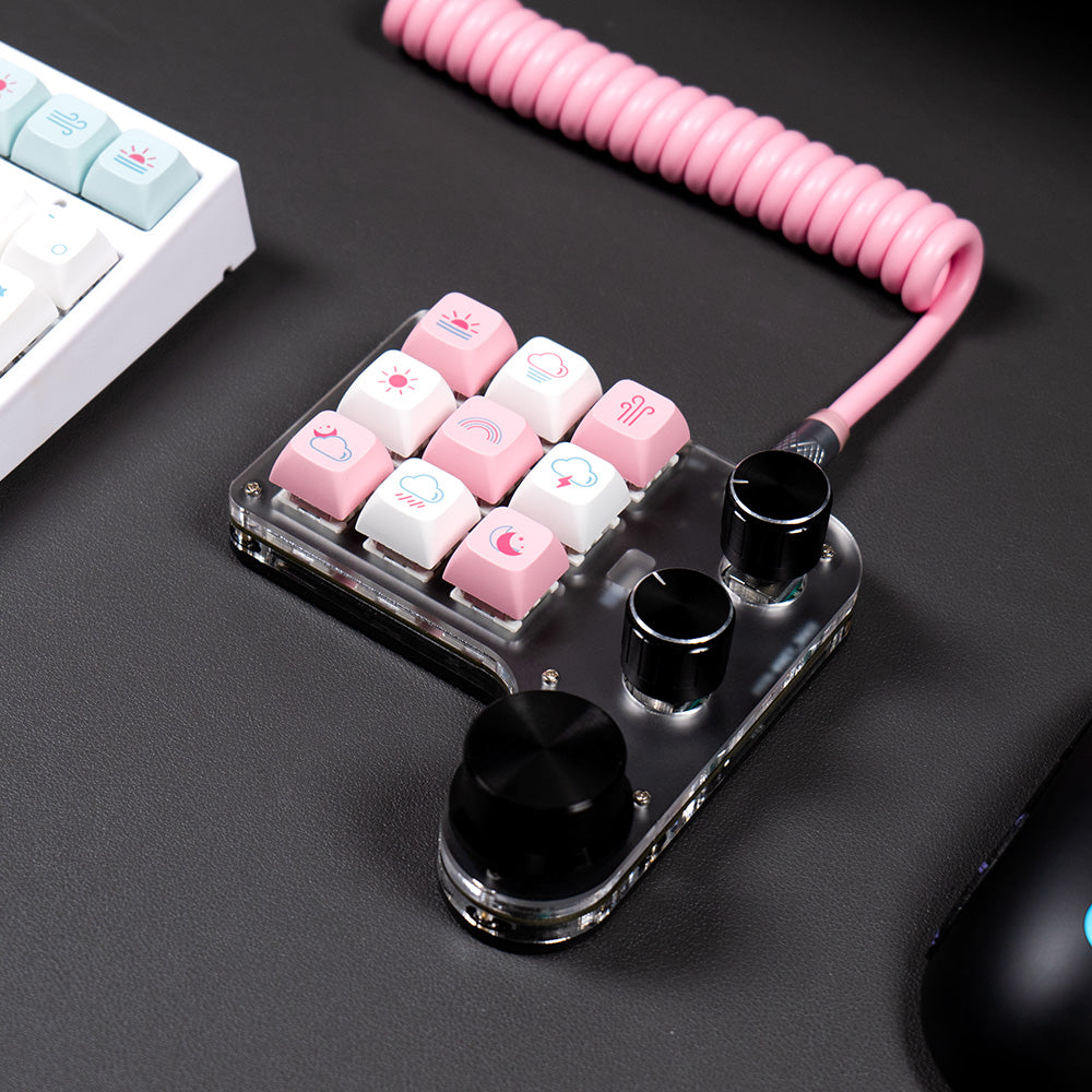 Compact 9-key programmable mini keyboard in a gaming desk setup
