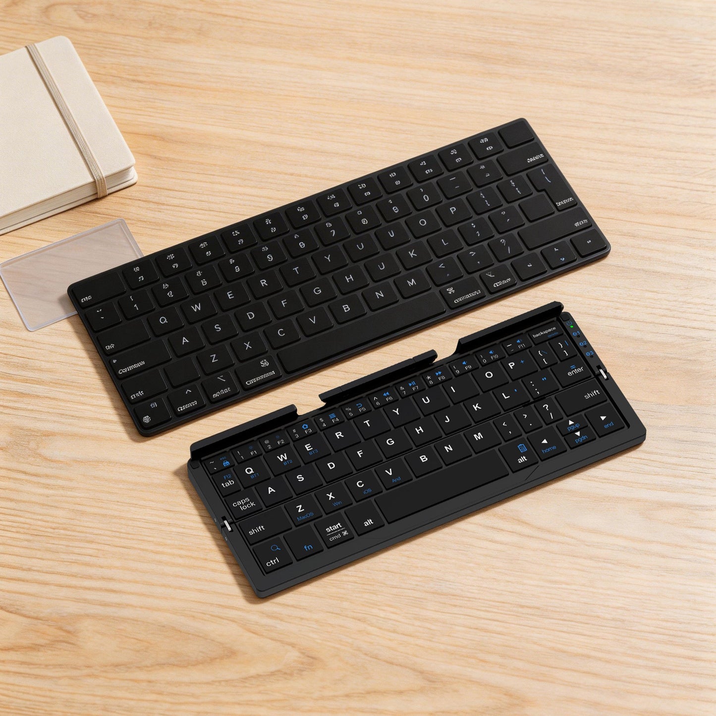 Black foldable Bluetooth keyboard shown open and folded
